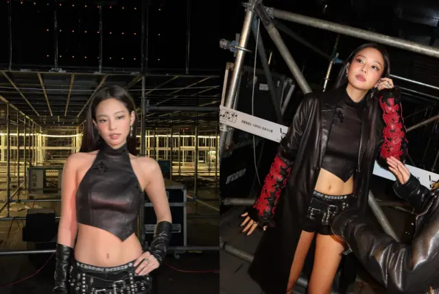 Jennie佩戴多层克罗心银饰项链,搭配烟熏妆和十字架图案美甲的特写