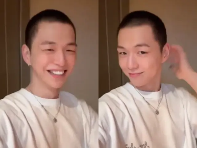 姜丹尼尔在入伍前夕摘下帽子，面带微笑向粉丝展示刚剪好的寸头造型