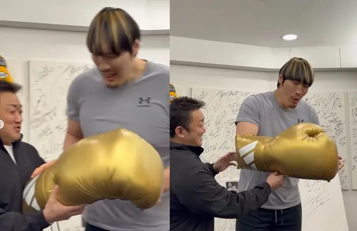 崔洪万试戴马东锡特意准备的黄金巨型拳套,画面极具反差萌